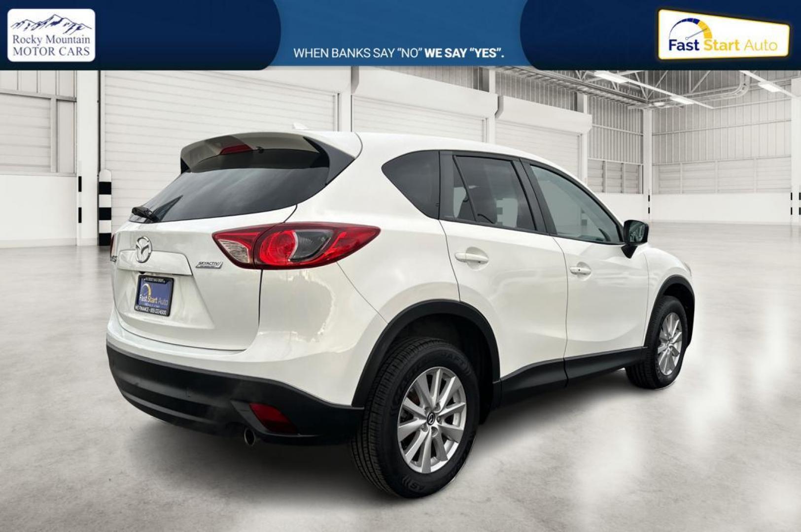 2016 White Mazda CX-5 Touring (JM3KE2CY5G0) with an 2.5L L4 DOHC 16V engine, 6-Speed Automatic transmission, located at 767 S State Road, Pleasant Grove, UT, 84062, (801) 785-1058, 40.354839, -111.736687 - Photo#2