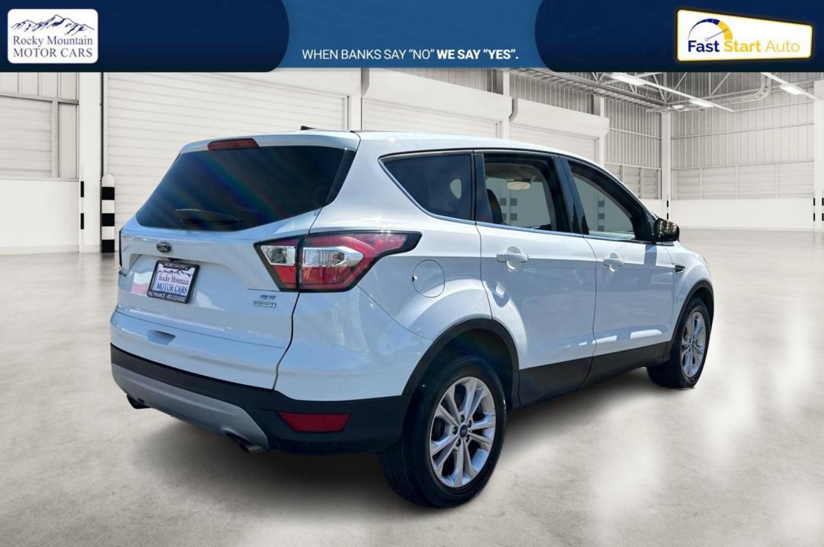 2017 White Ford Escape SE FWD (1FMCU0GDXHU) with an 1.5L L4 DOHC 16V engine, 6A transmission, located at 767 S State Road, Pleasant Grove, UT, 84062, (801) 785-1058, 40.354839, -111.736687 - Photo#2