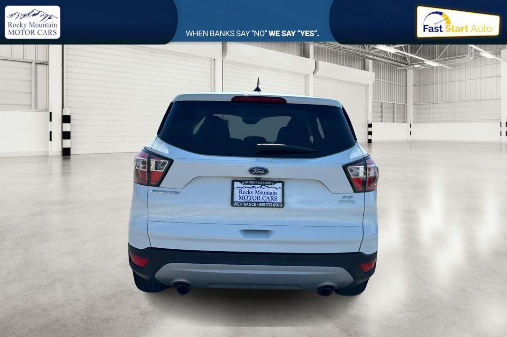 2017 White Ford Escape SE FWD (1FMCU0GDXHU) with an 1.5L L4 DOHC 16V engine, 6A transmission, located at 767 S State Road, Pleasant Grove, UT, 84062, (801) 785-1058, 40.354839, -111.736687 - Photo#3