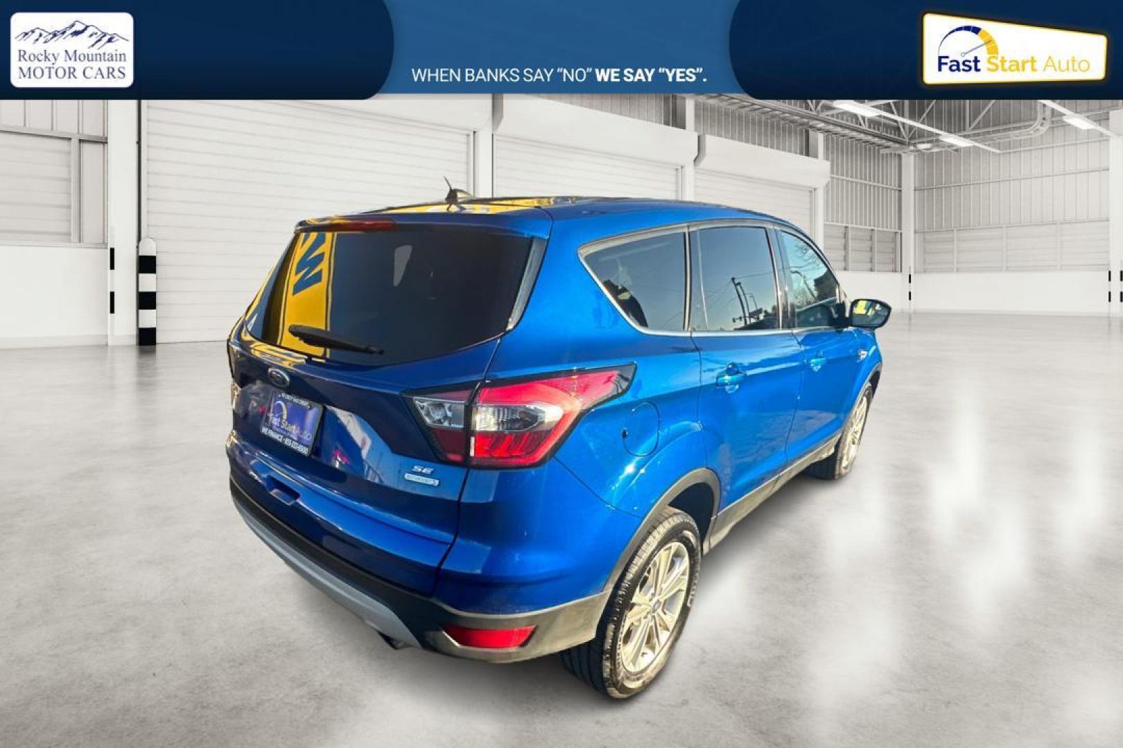 2017 Blue Ford Escape SE FWD (1FMCU0GD9HU) with an 1.5L L4 DOHC 16V engine, 6A transmission, located at 7755 State Street, Midvale, UT, 84047, (801) 753-9063, 40.610329, -111.892159 - Photo#2