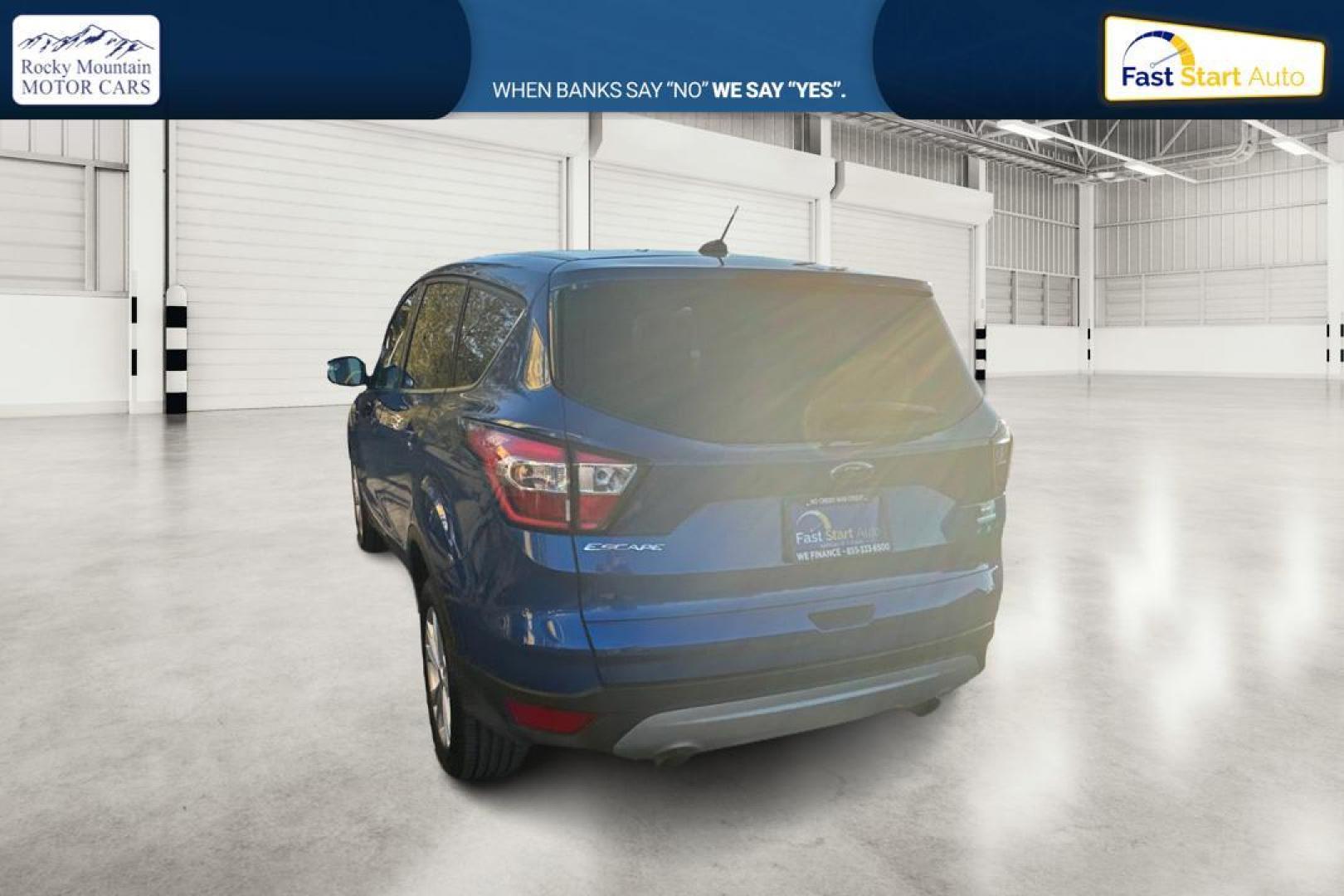 2017 Blue Ford Escape SE FWD (1FMCU0GD9HU) with an 1.5L L4 DOHC 16V engine, 6A transmission, located at 7755 State Street, Midvale, UT, 84047, (801) 753-9063, 40.610329, -111.892159 - Photo#4