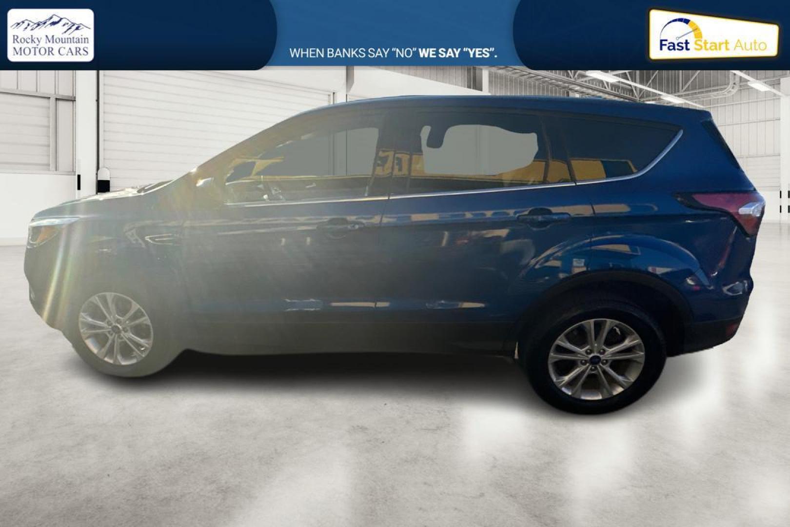 2017 Blue Ford Escape SE FWD (1FMCU0GD9HU) with an 1.5L L4 DOHC 16V engine, 6A transmission, located at 7755 State Street, Midvale, UT, 84047, (801) 753-9063, 40.610329, -111.892159 - Photo#5