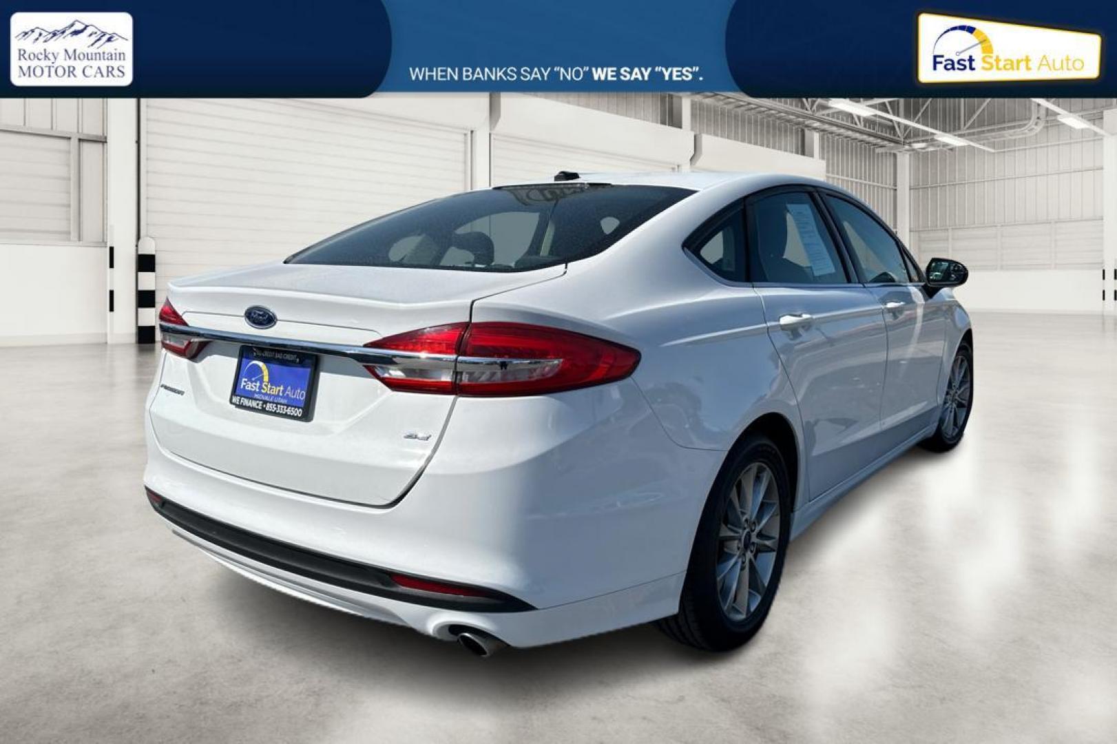 2017 White Ford Fusion SE (3FA6P0H74HR) with an 2.5L L4 DOHC 16V engine, 6A transmission, located at 344 S Washington Blvd, Ogden, UT, 84404, (801) 399-1799, 41.255482, -111.970848 - Photo#2