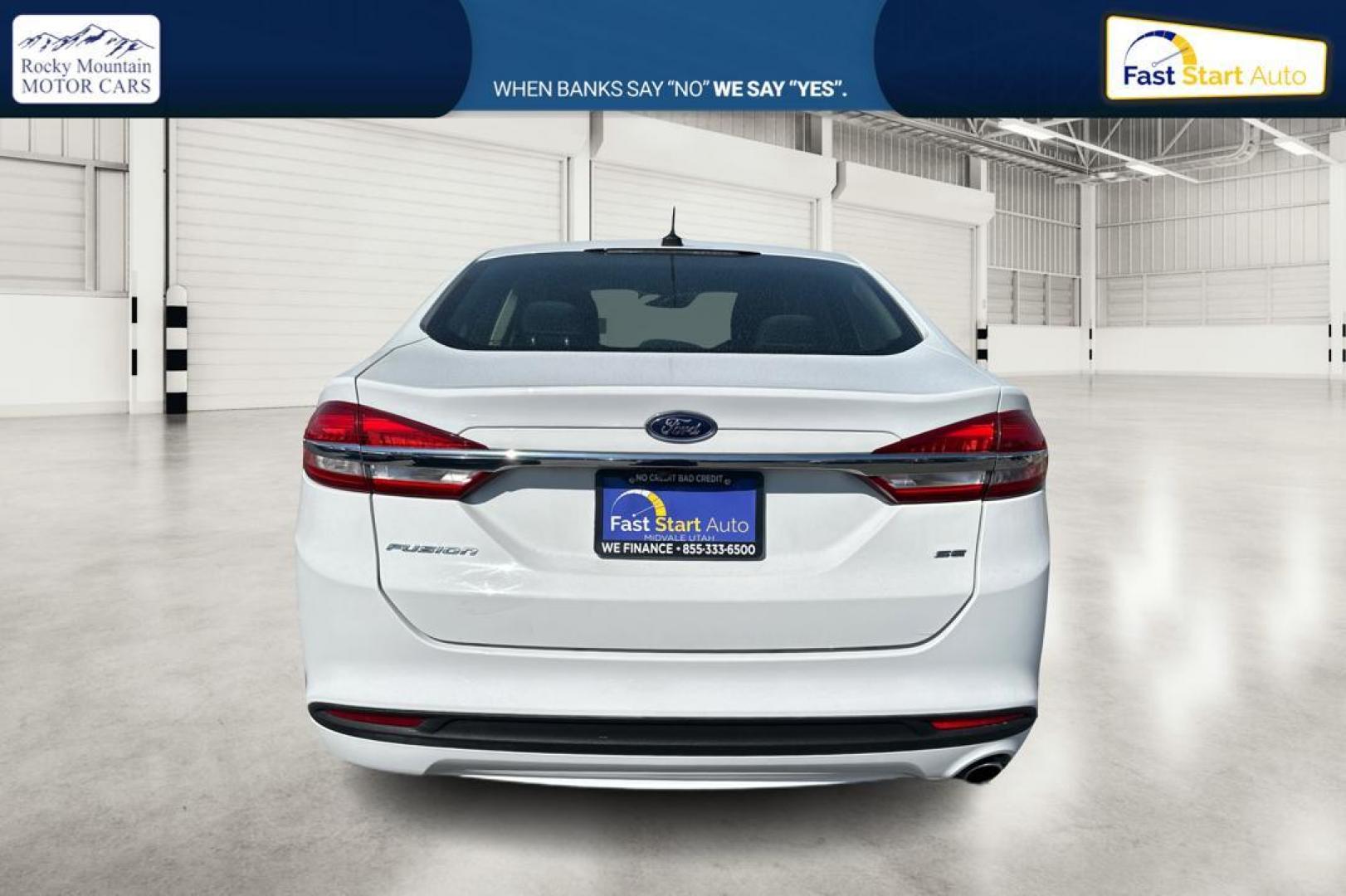 2017 White Ford Fusion SE (3FA6P0H74HR) with an 2.5L L4 DOHC 16V engine, 6A transmission, located at 344 S Washington Blvd, Ogden, UT, 84404, (801) 399-1799, 41.255482, -111.970848 - Photo#3