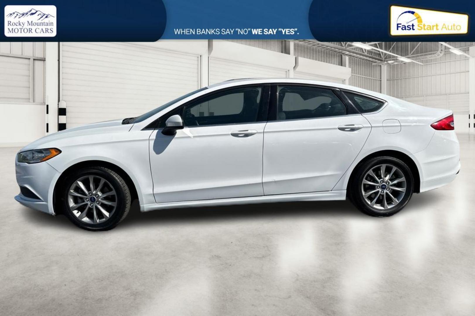 2017 White Ford Fusion SE (3FA6P0H74HR) with an 2.5L L4 DOHC 16V engine, 6A transmission, located at 344 S Washington Blvd, Ogden, UT, 84404, (801) 399-1799, 41.255482, -111.970848 - Photo#5