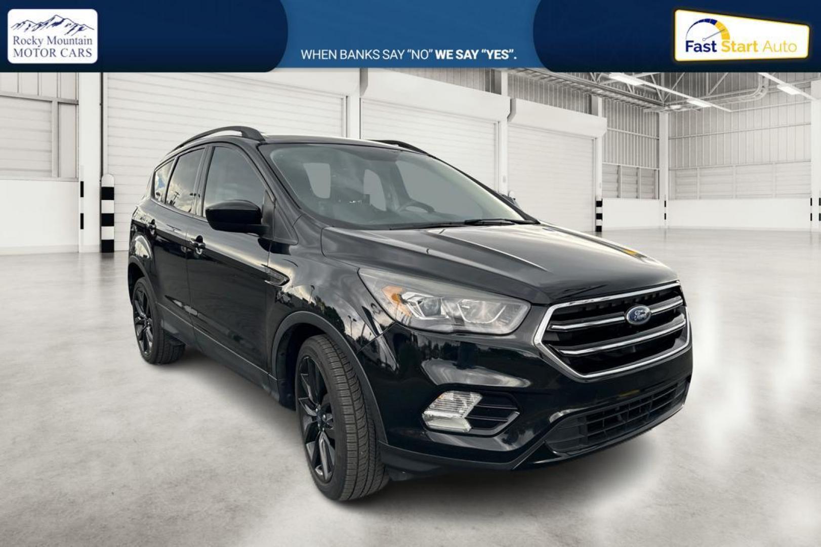 2018 Black Ford Escape SE FWD (1FMCU0GD9JU) with an 1.5L L4 DOHC 16V engine, 6A transmission, located at 7755 State Street, Midvale, UT, 84047, (801) 753-9063, 40.610329, -111.892159 - Photo#0