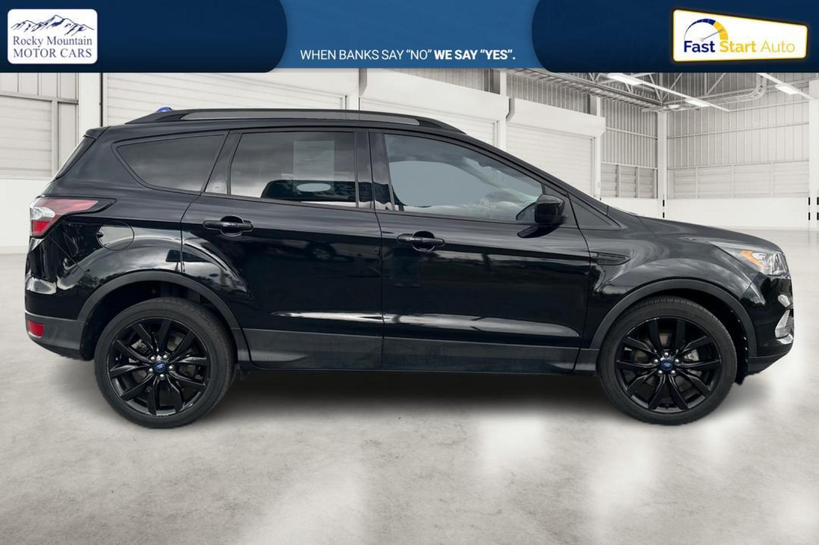 2018 Black Ford Escape SE FWD (1FMCU0GD9JU) with an 1.5L L4 DOHC 16V engine, 6A transmission, located at 7755 State Street, Midvale, UT, 84047, (801) 753-9063, 40.610329, -111.892159 - Photo#1