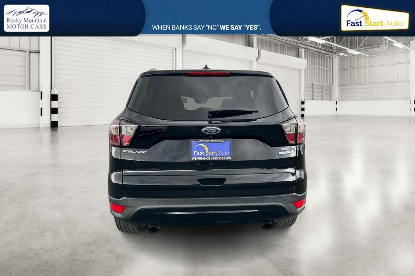 2018 Black Ford Escape SE FWD (1FMCU0GD9JU) with an 1.5L L4 DOHC 16V engine, 6A transmission, located at 7755 State Street, Midvale, UT, 84047, (801) 753-9063, 40.610329, -111.892159 - Photo#3