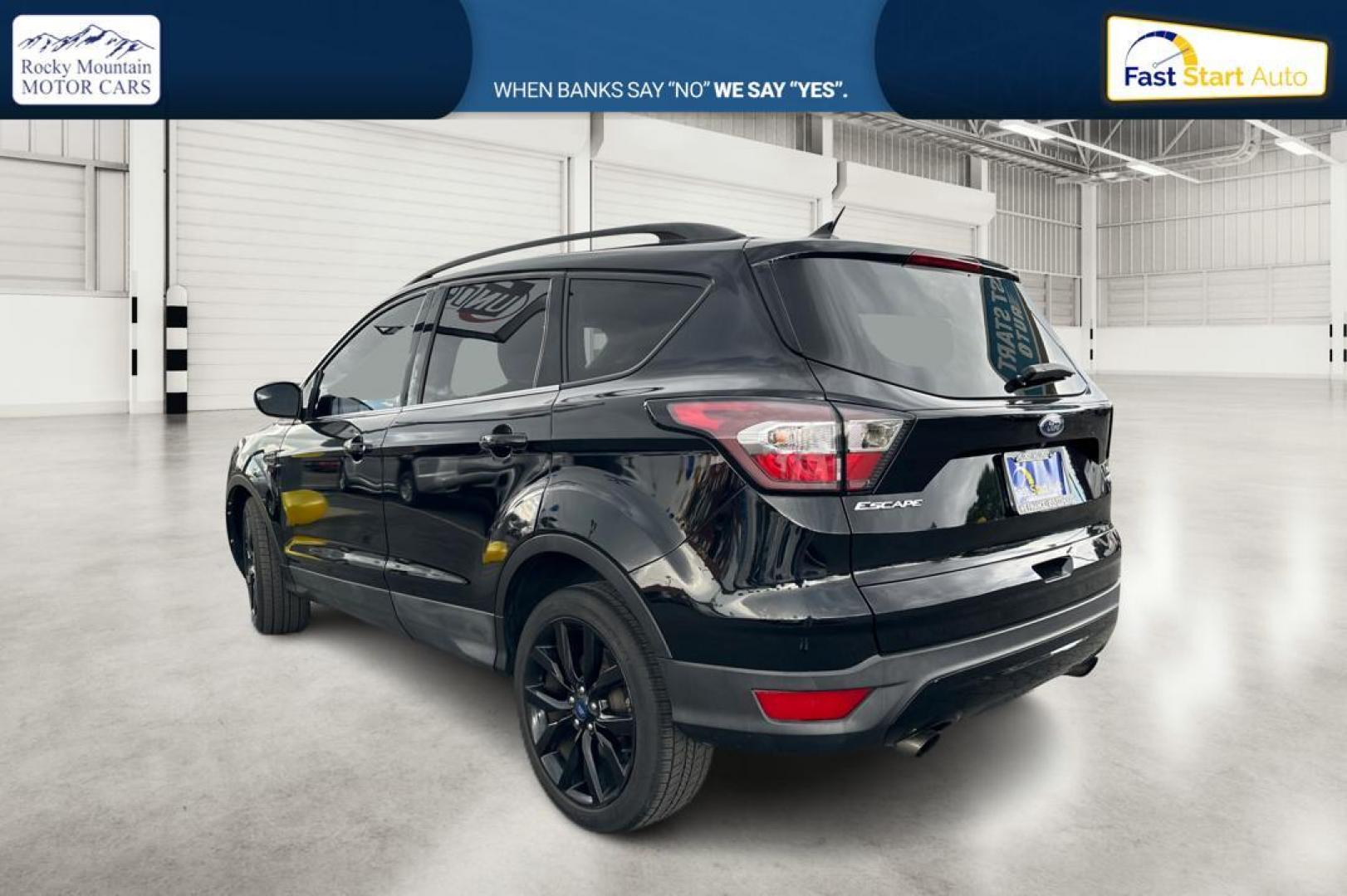 2018 Black Ford Escape SE FWD (1FMCU0GD9JU) with an 1.5L L4 DOHC 16V engine, 6A transmission, located at 7755 State Street, Midvale, UT, 84047, (801) 753-9063, 40.610329, -111.892159 - Photo#4