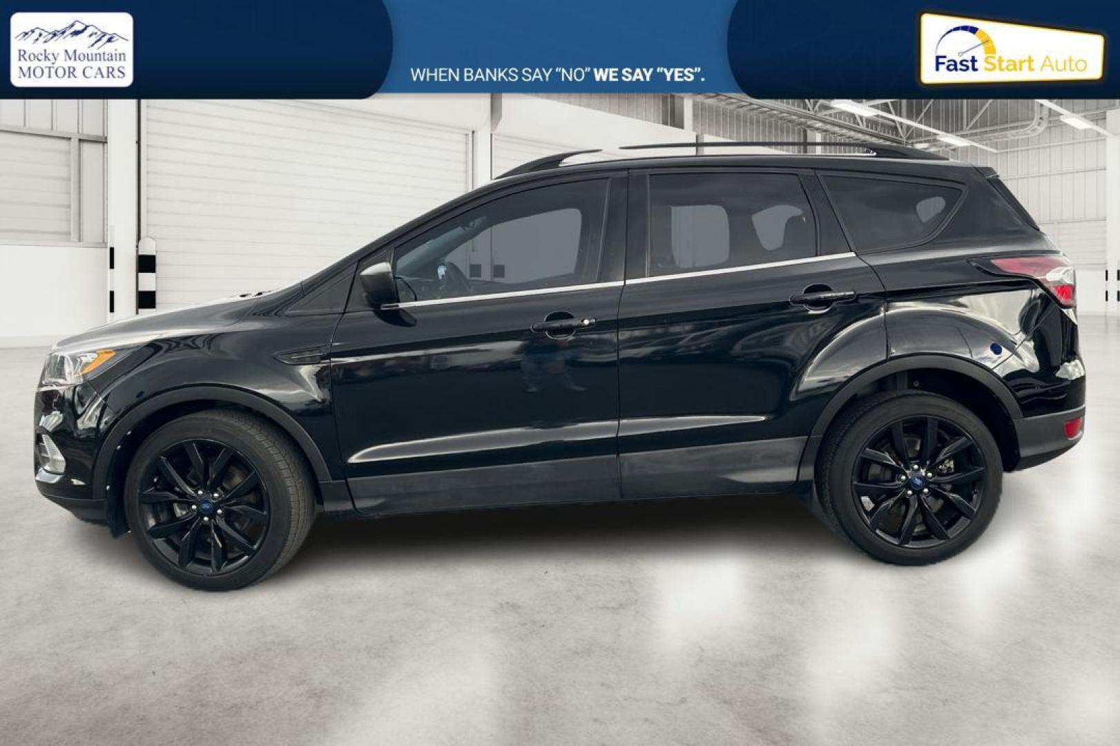 2018 Black Ford Escape SE FWD (1FMCU0GD9JU) with an 1.5L L4 DOHC 16V engine, 6A transmission, located at 7755 State Street, Midvale, UT, 84047, (801) 753-9063, 40.610329, -111.892159 - Photo#5