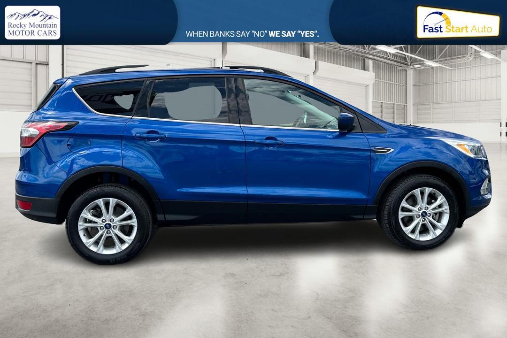 2018 Blue Ford Escape SE 4WD (1FMCU9GD0JU) with an 1.5L L4 DOHC 16V engine, 6A transmission, located at 7755 State Street, Midvale, UT, 84047, (801) 753-9063, 40.610329, -111.892159 - Photo#1