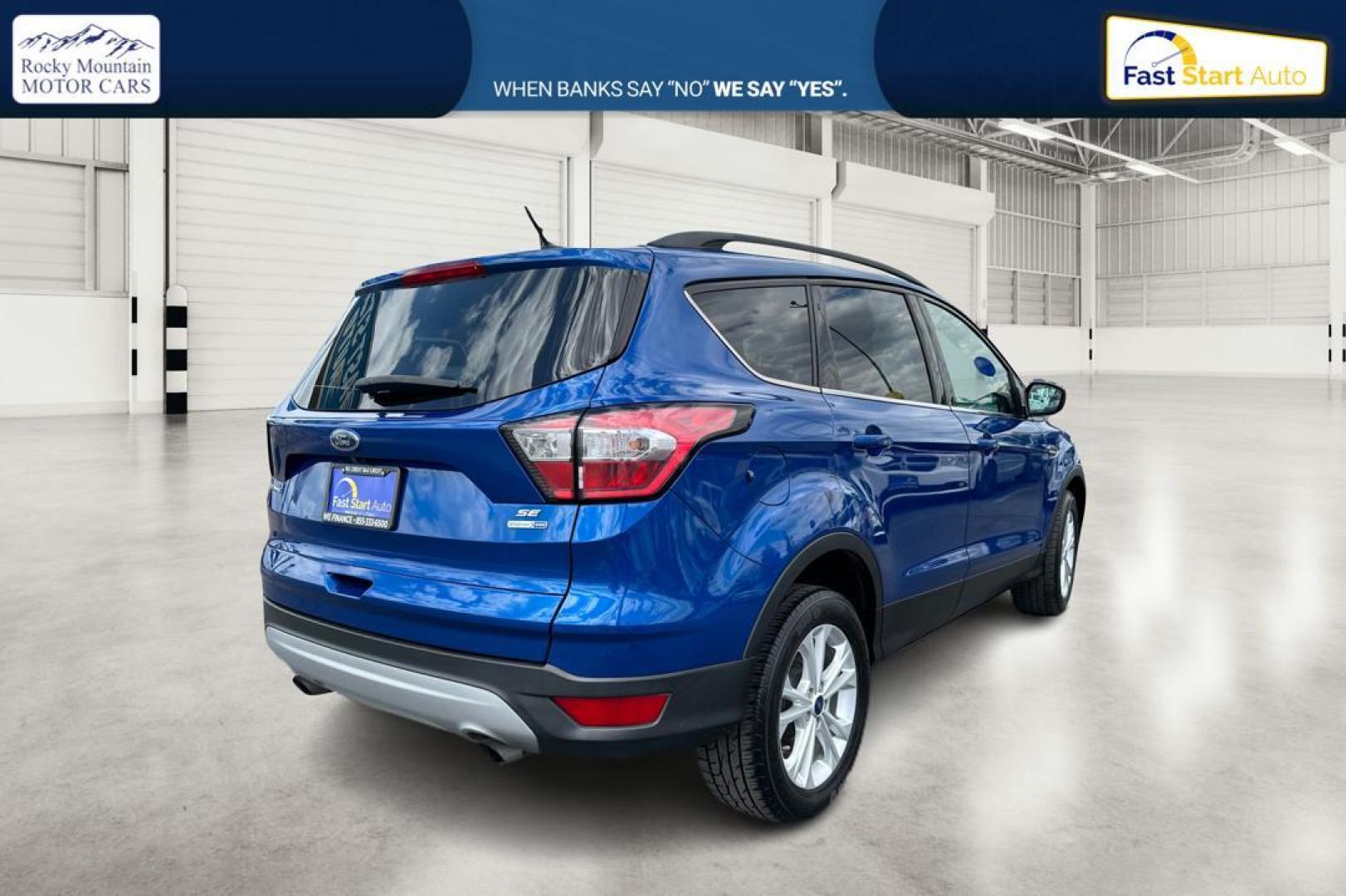 2018 Blue Ford Escape SE 4WD (1FMCU9GD0JU) with an 1.5L L4 DOHC 16V engine, 6A transmission, located at 7755 State Street, Midvale, UT, 84047, (801) 753-9063, 40.610329, -111.892159 - Photo#2