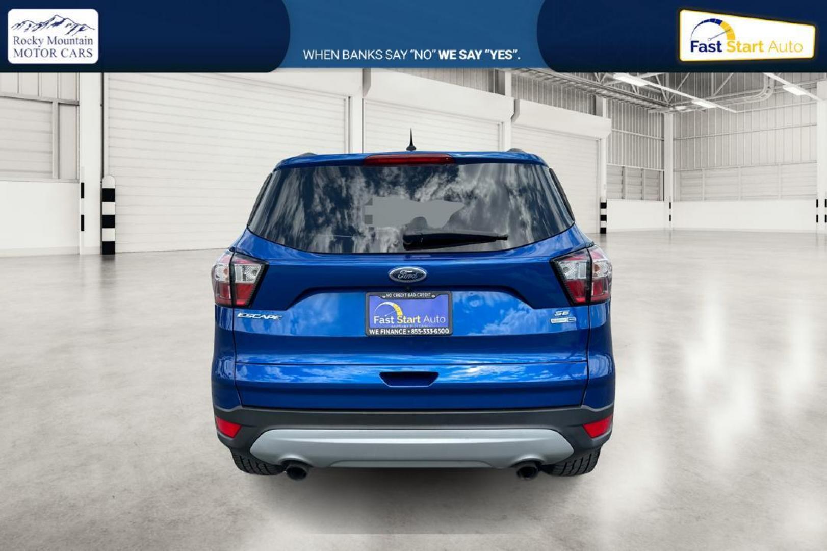 2018 Blue Ford Escape SE 4WD (1FMCU9GD0JU) with an 1.5L L4 DOHC 16V engine, 6A transmission, located at 7755 State Street, Midvale, UT, 84047, (801) 753-9063, 40.610329, -111.892159 - Photo#3