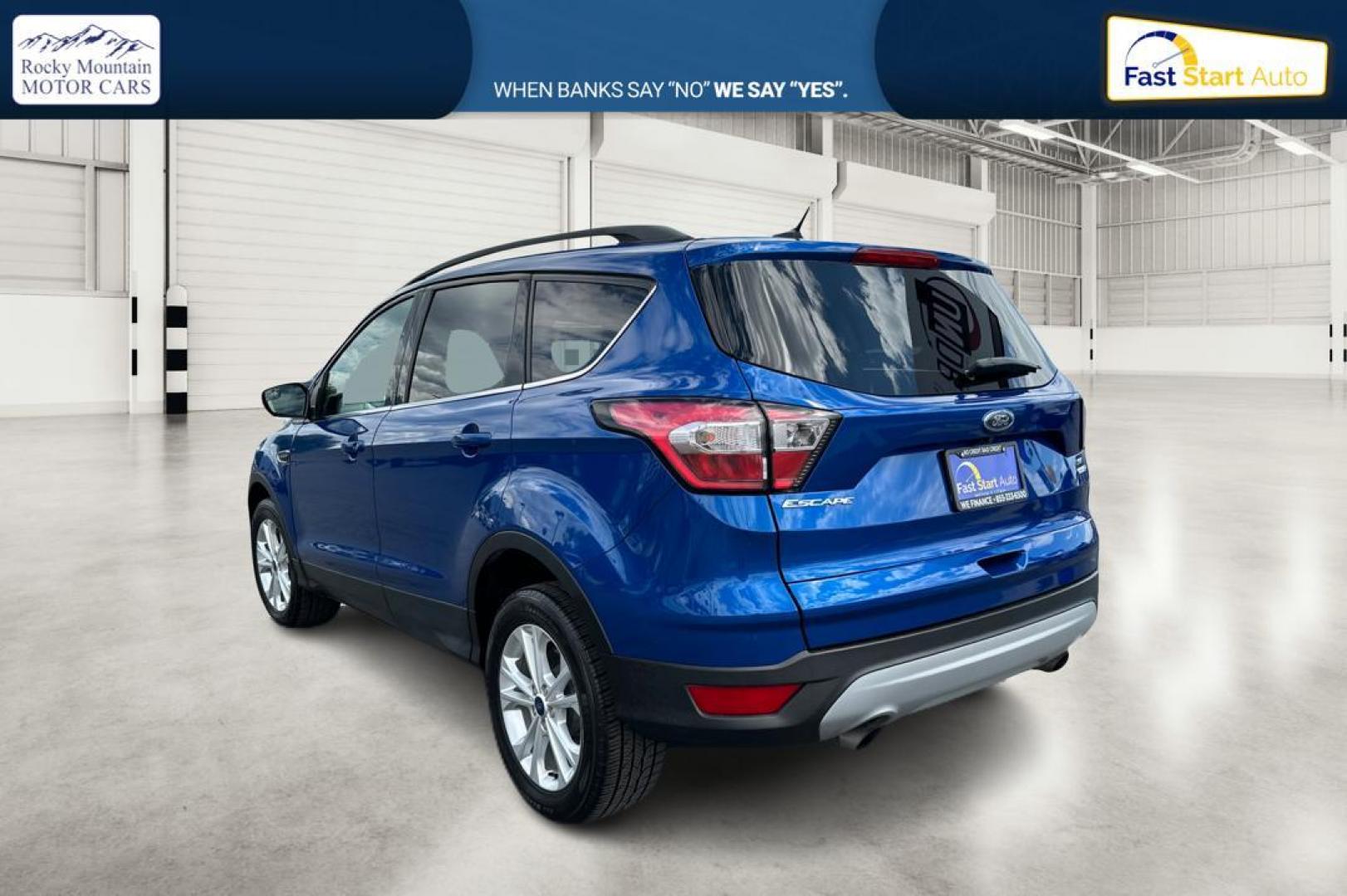 2018 Blue Ford Escape SE 4WD (1FMCU9GD0JU) with an 1.5L L4 DOHC 16V engine, 6A transmission, located at 7755 State Street, Midvale, UT, 84047, (801) 753-9063, 40.610329, -111.892159 - Photo#4