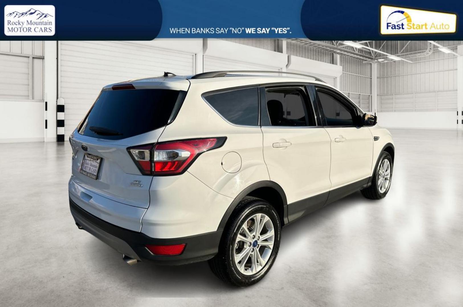 2018 White Ford Escape SE FWD (1FMCU0G92JU) with an 2.0L L4 DOHC 16V engine, 6A transmission, located at 7755 State Street, Midvale, UT, 84047, (801) 753-9063, 40.610329, -111.892159 - Photo#2