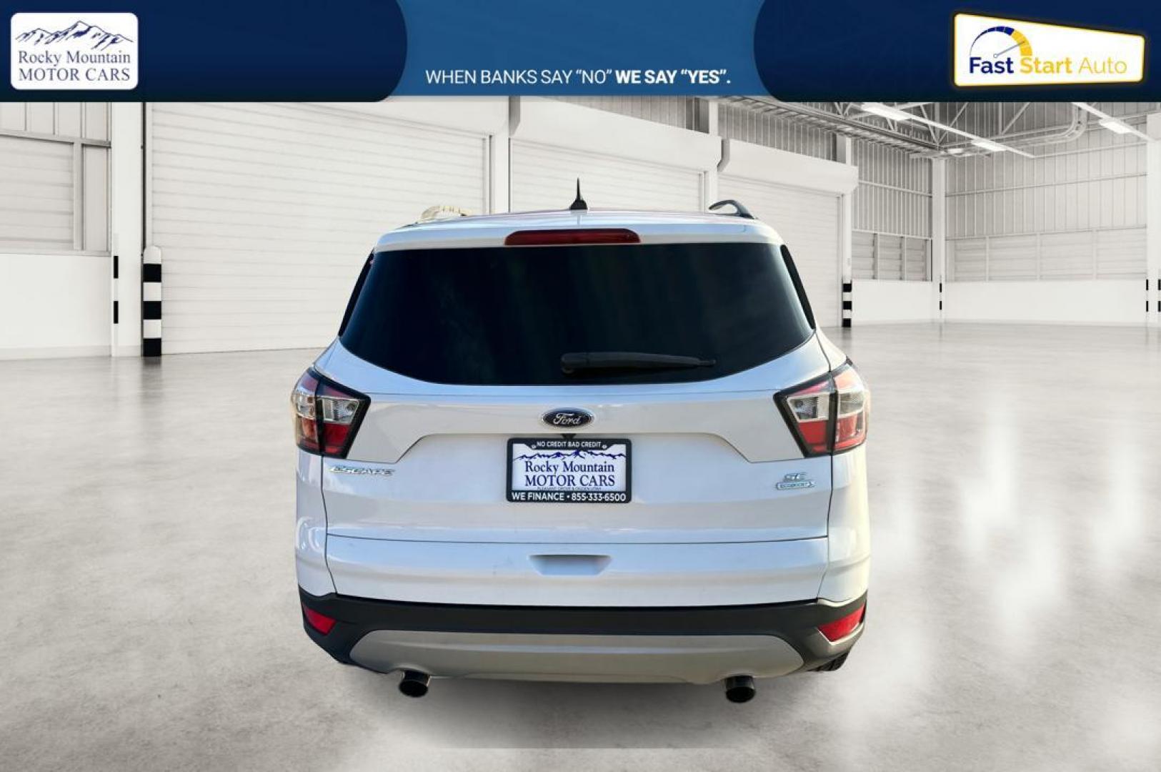 2018 White Ford Escape SE FWD (1FMCU0G92JU) with an 2.0L L4 DOHC 16V engine, 6A transmission, located at 7755 State Street, Midvale, UT, 84047, (801) 753-9063, 40.610329, -111.892159 - Photo#3