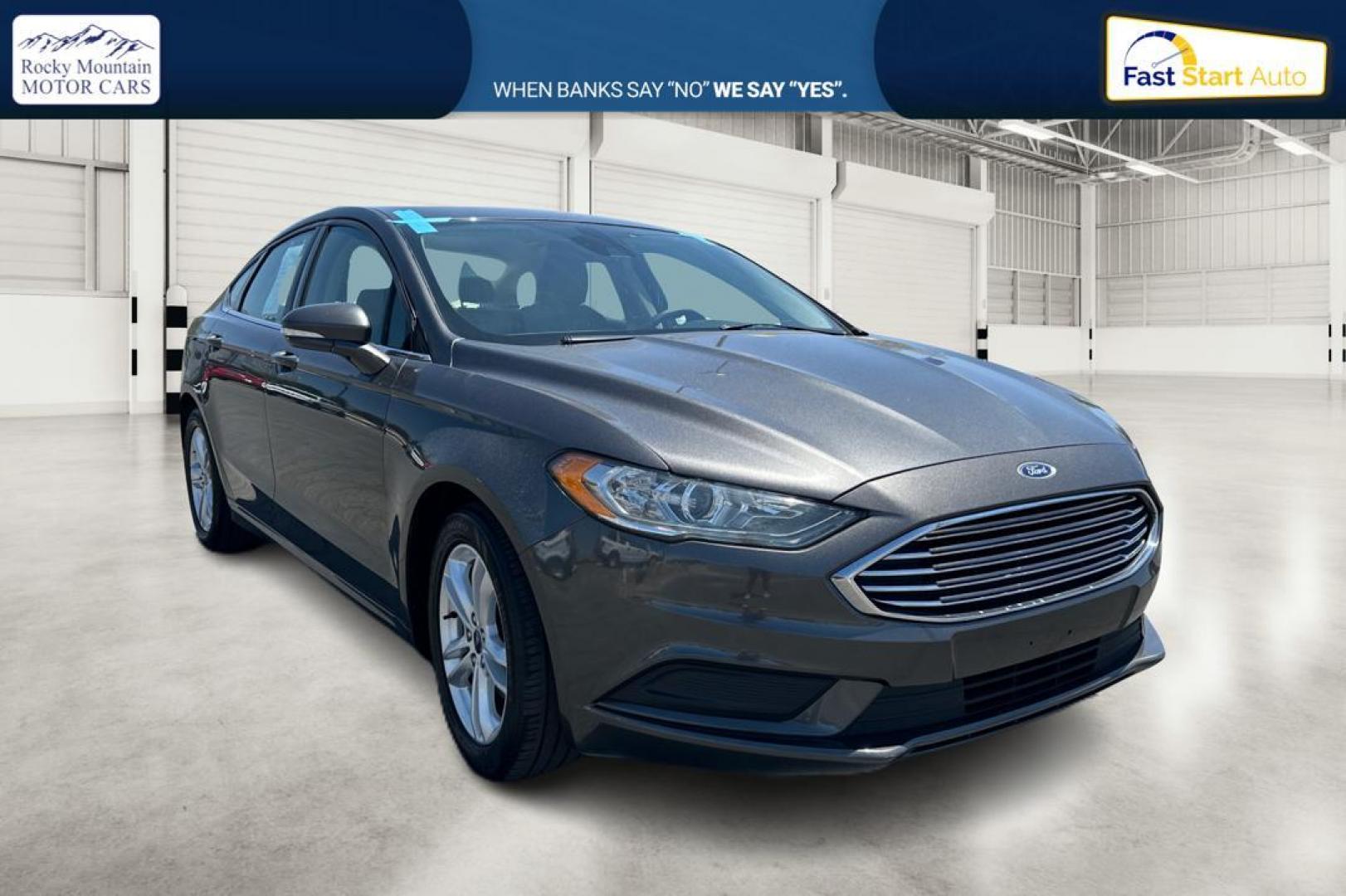 2018 Gray Ford Fusion SE (3FA6P0HD7JR) with an 1.5L L4 DOHC 16V engine, 6A transmission, located at 7755 State Street, Midvale, UT, 84047, (801) 753-9063, 40.610329, -111.892159 - Photo#0