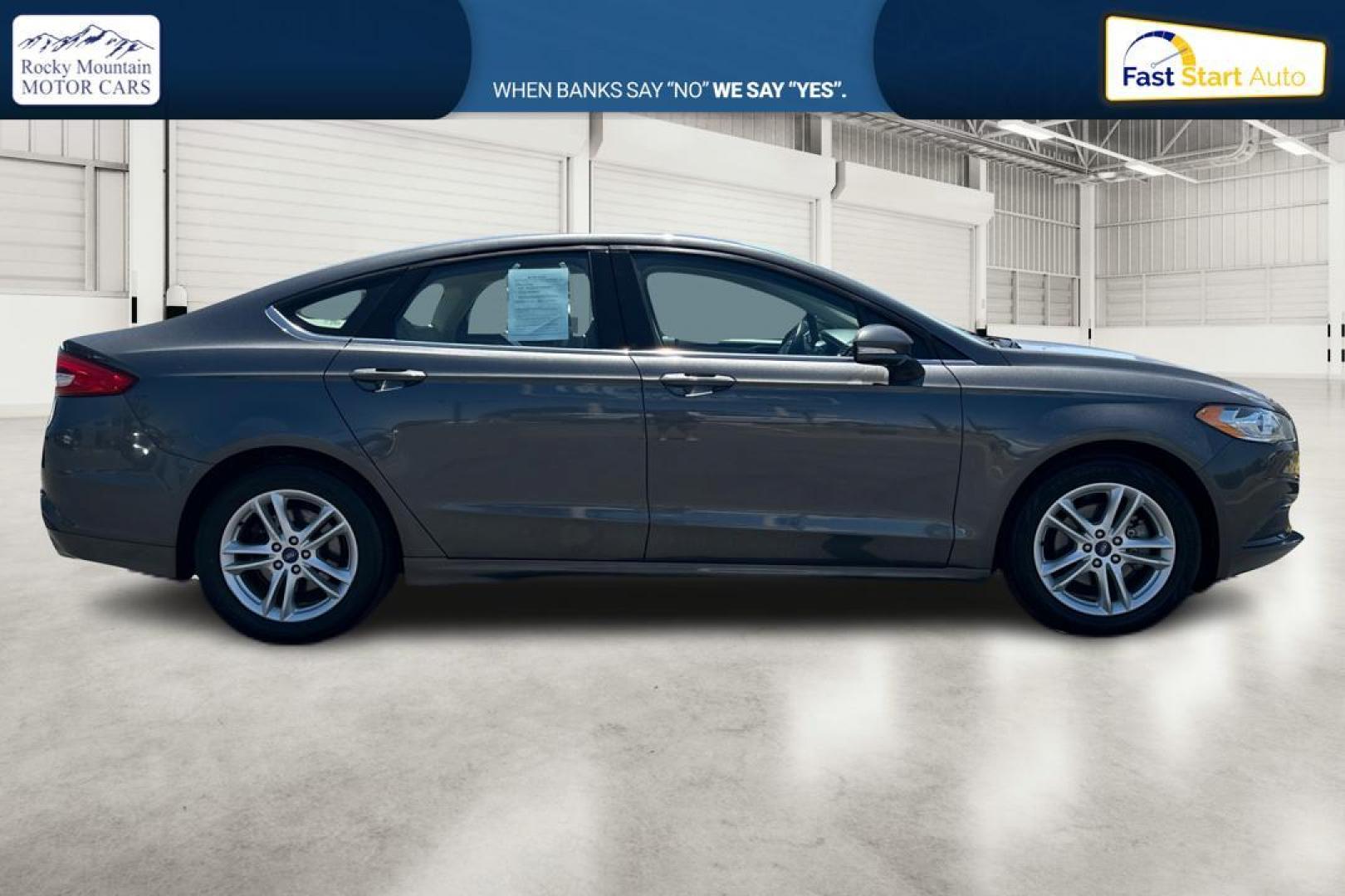 2018 Gray Ford Fusion SE (3FA6P0HD7JR) with an 1.5L L4 DOHC 16V engine, 6A transmission, located at 7755 State Street, Midvale, UT, 84047, (801) 753-9063, 40.610329, -111.892159 - Photo#1