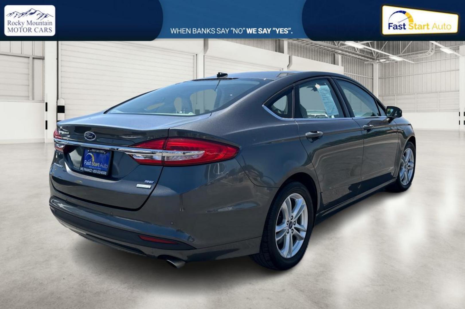 2018 Gray Ford Fusion SE (3FA6P0HD7JR) with an 1.5L L4 DOHC 16V engine, 6A transmission, located at 7755 State Street, Midvale, UT, 84047, (801) 753-9063, 40.610329, -111.892159 - Photo#2