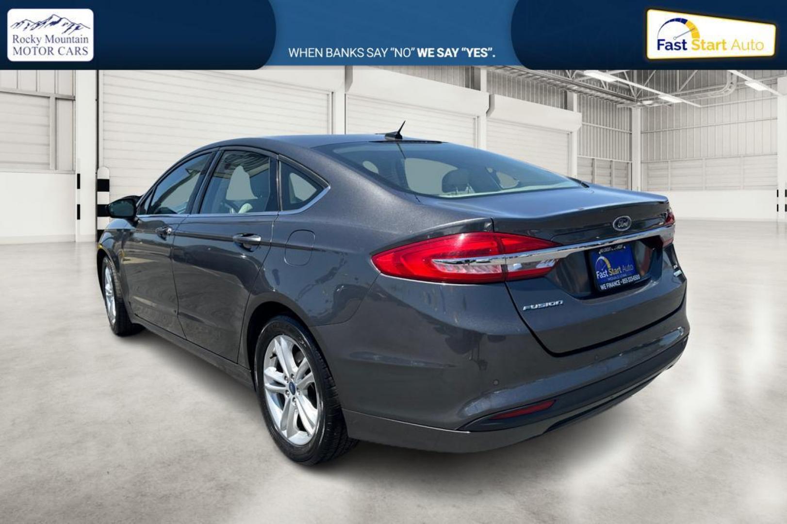 2018 Gray Ford Fusion SE (3FA6P0HD7JR) with an 1.5L L4 DOHC 16V engine, 6A transmission, located at 7755 State Street, Midvale, UT, 84047, (801) 753-9063, 40.610329, -111.892159 - Photo#4