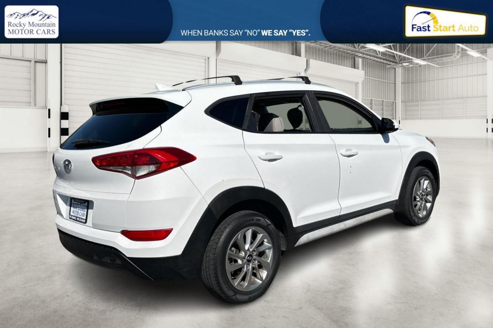 2018 White Hyundai Tucson SE (KM8J33A46JU) with an 2.0L L4 DOHC 16V engine, 6A transmission, located at 344 S Washington Blvd, Ogden, UT, 84404, (801) 399-1799, 41.255482, -111.970848 - Photo#2