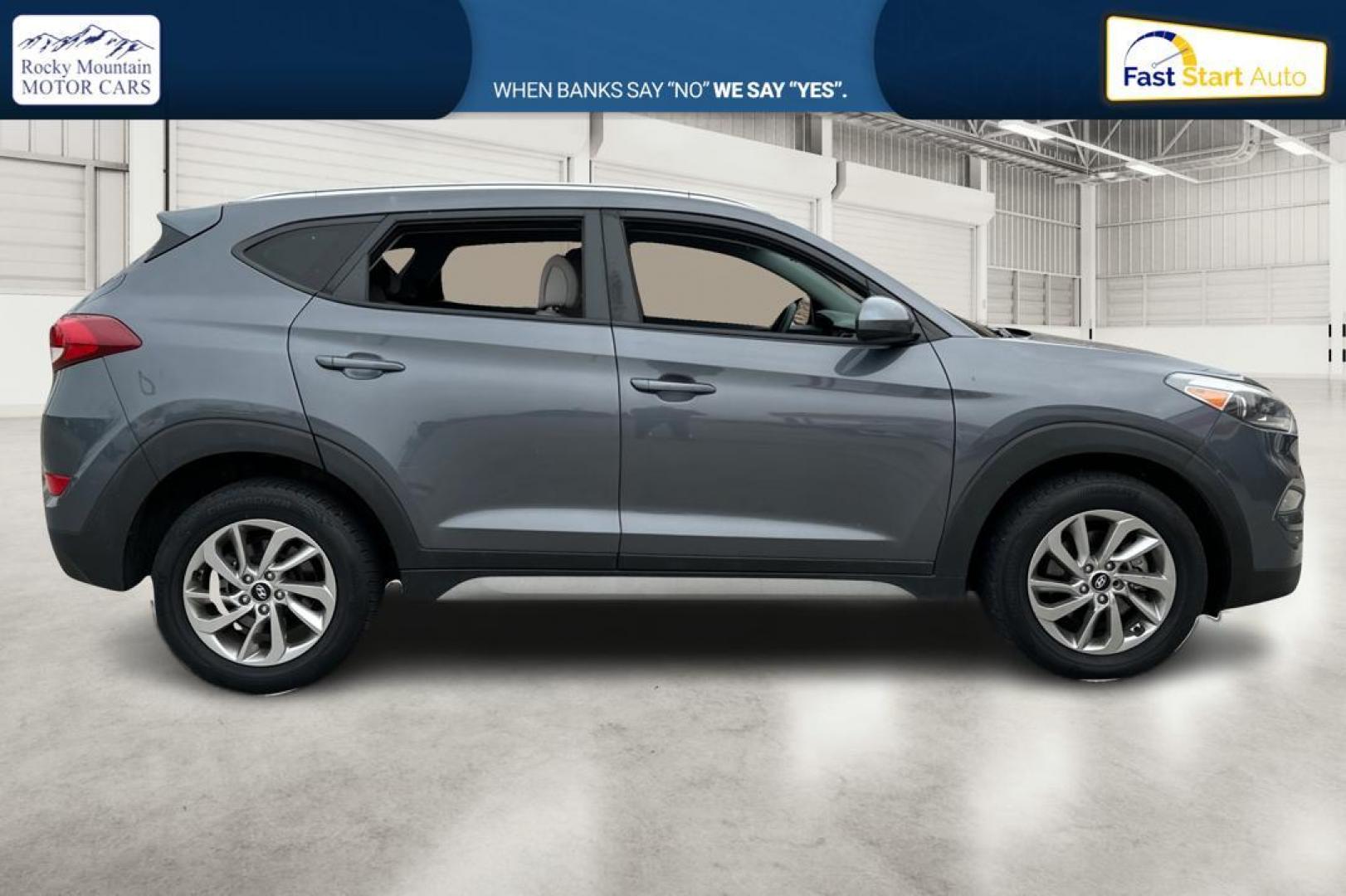 2018 Gray Hyundai Tucson SE (KM8J33A48JU) with an 2.0L L4 DOHC 16V engine, 6A transmission, located at 344 S Washington Blvd, Ogden, UT, 84404, (801) 399-1799, 41.255482, -111.970848 - Photo#1