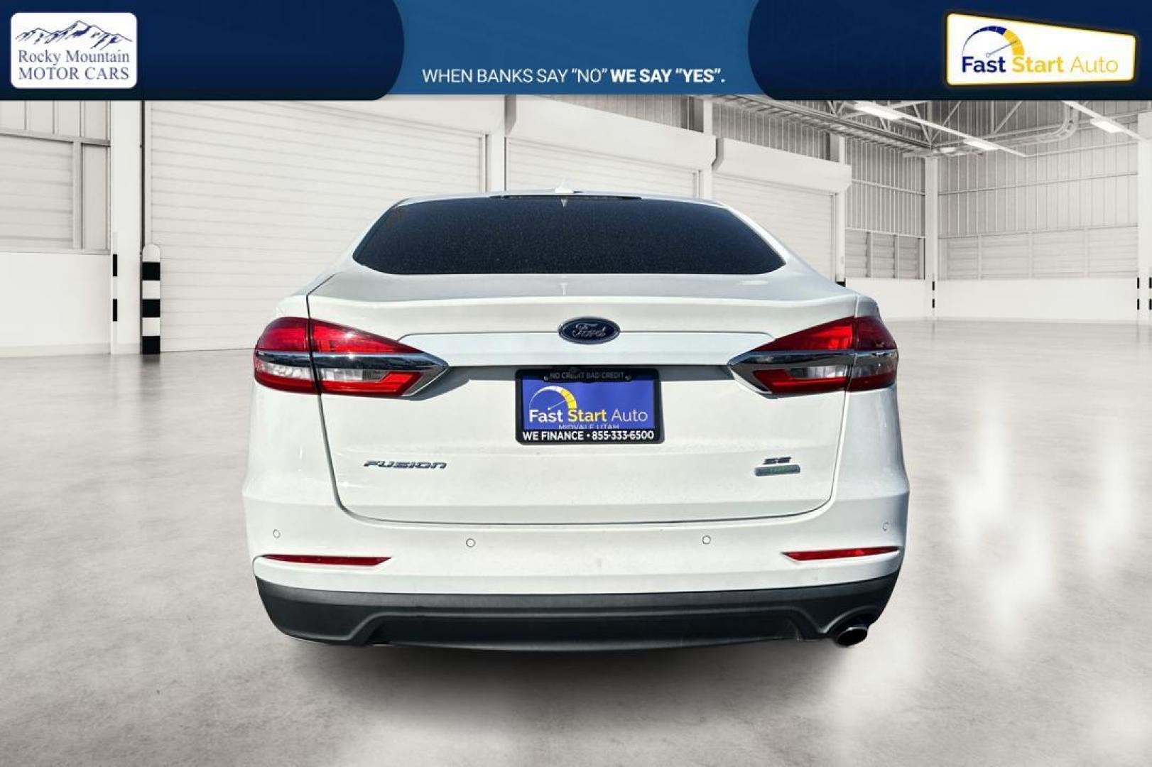 2019 White Ford Fusion SE (3FA6P0HD1KR) with an 1.5L L4 DOHC 16V engine, 6A transmission, located at 7755 State Street, Midvale, UT, 84047, (801) 753-9063, 40.610329, -111.892159 - Photo#4