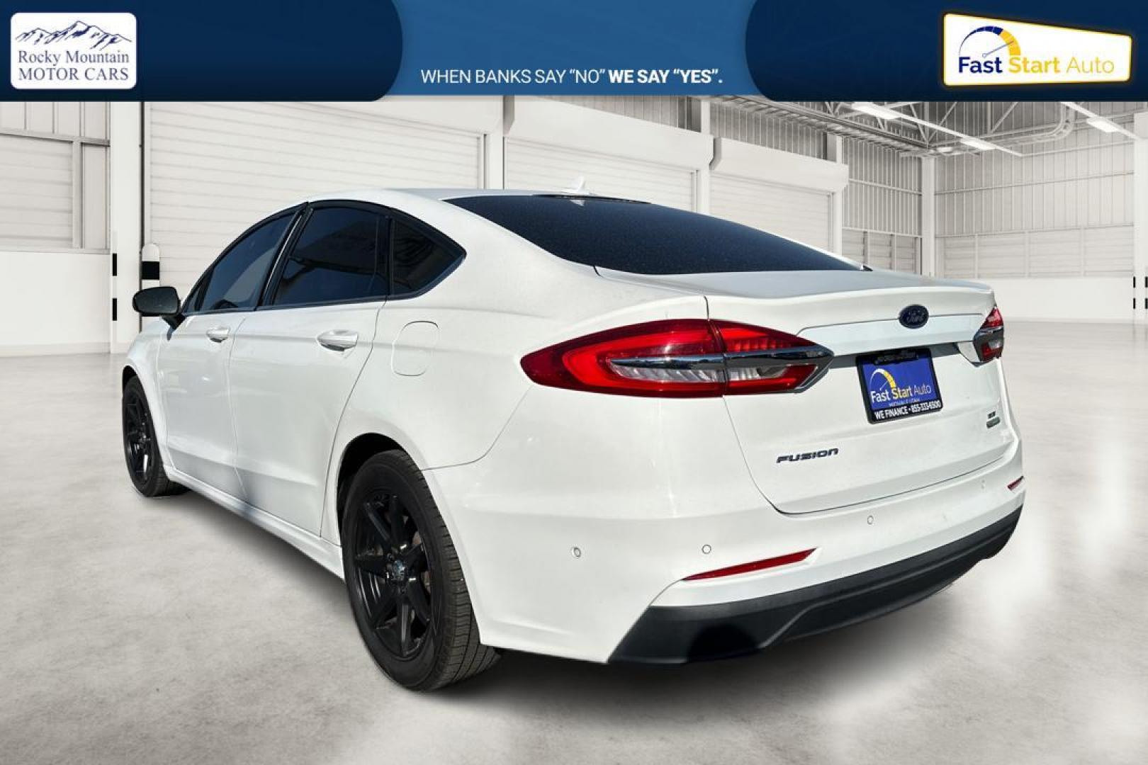 2019 White Ford Fusion SE (3FA6P0HD1KR) with an 1.5L L4 DOHC 16V engine, 6A transmission, located at 7755 State Street, Midvale, UT, 84047, (801) 753-9063, 40.610329, -111.892159 - Photo#5